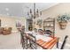 Bright dining room with a large wooden table and chandelier at 11816 Altamonte Ct, Venice, FL 34293