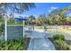 Fenced dog park with shaded area and rules at 11816 Altamonte Ct, Venice, FL 34293