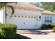 White two-car garage and front entry at 11816 Altamonte Ct, Venice, FL 34293