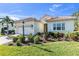 Beautiful one-story home with tile roof, landscaping, and a two-car garage at 11816 Altamonte Ct, Venice, FL 34293