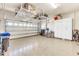 Garage with overhead storage and epoxy floor at 11816 Altamonte Ct, Venice, FL 34293