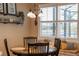 Bright kitchen nook with built-in bench seating and a round table at 11816 Altamonte Ct, Venice, FL 34293