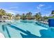 Relaxing pool area with a waterslide and shaded seating areas at 11816 Altamonte Ct, Venice, FL 34293