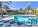 Inviting resort-style pool with checkered tile deck at 11816 Altamonte Ct, Venice, FL 34293