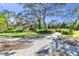 Scenic walking path with decorative brickwork at 11816 Altamonte Ct, Venice, FL 34293