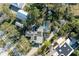 Bird's-eye view of property showcasing house, pool, and surrounding trees at 1220 De Narvaez Ave, Bradenton, FL 34209