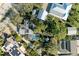 Aerial view showing home with pool, detached structures, and lush landscaping at 1220 De Narvaez Ave, Bradenton, FL 34209