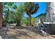 Backyard with gravel ground, tropical plants, and AC unit at 1220 De Narvaez Ave, Bradenton, FL 34209