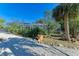 Landscaped backyard with a large enclosure and tropical plants at 1220 De Narvaez Ave, Bradenton, FL 34209