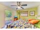 Bedroom with a king-size bed, access to the backyard, and a ceiling fan at 1220 De Narvaez Ave, Bradenton, FL 34209