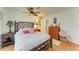 Bedroom with tiled floors, bamboo bed frame, and dresser at 1220 De Narvaez Ave, Bradenton, FL 34209