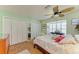 Bright bedroom with tiled floors, a ceiling fan, and built-in closet at 1220 De Narvaez Ave, Bradenton, FL 34209