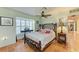 Bedroom with tiled floors, bamboo bed frame, and window shutters at 1220 De Narvaez Ave, Bradenton, FL 34209