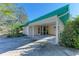 Covered carport with adjacent screened porch at 1220 De Narvaez Ave, Bradenton, FL 34209