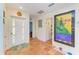 Bright entryway with terracotta tile floor, and white door at 1220 De Narvaez Ave, Bradenton, FL 34209