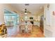 Modern kitchen with white cabinets, granite island, and terracotta tile floors at 1220 De Narvaez Ave, Bradenton, FL 34209