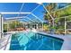 Large screened-in pool area with patio furniture at 1220 De Narvaez Ave, Bradenton, FL 34209