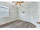 Simple bedroom with wood flooring and ceiling fan at 12728 Avelar Creek Dr, Riverview, FL 33578