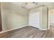 Bedroom with double door closet and wood flooring at 12728 Avelar Creek Dr, Riverview, FL 33578