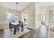 Bright dining area with hardwood floors and modern light fixture at 12728 Avelar Creek Dr, Riverview, FL 33578