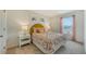 Charming bedroom with floral bedding and natural light at 13014 Bayberry Way, Parrish, FL 34219