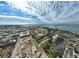 Aerial perspective showcasing a cityscape, waterfront, and residential buildings under a vibrant sky at 1335 12Th St, Sarasota, FL 34236