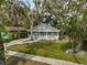 Aerial view of a charming house with a teal door and a landscaped yard at 1335 12Th St, Sarasota, FL 34236