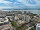 Aerial view of a waterfront community with luxury high-rise buildings and a swimming pool at 1335 12Th St, Sarasota, FL 34236