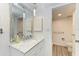 Modern bathroom with marble vanity and shower at 1510 1St W Ave # 303, Bradenton, FL 34205