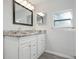 Updated bathroom with double vanity and granite countertops at 1717 32Nd St, Sarasota, FL 34234