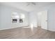 Well-lit bedroom featuring wood-look floors and a ceiling fan at 1717 32Nd St, Sarasota, FL 34234