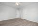 Well-lit bedroom with wood-look flooring and a large closet at 1717 32Nd St, Sarasota, FL 34234