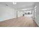 Open living room featuring light flooring and a view into the kitchen area at 1717 32Nd St, Sarasota, FL 34234