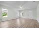 Bright living room with wood-look floors and multiple windows at 1717 32Nd St, Sarasota, FL 34234