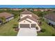 Two-story house with tile roof and two-car garage at 1748 Still River Dr, Venice, FL 34293