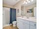 Clean bathroom with shower, toilet and white vanity at 1748 Still River Dr, Venice, FL 34293