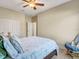 Spacious bedroom with a queen bed and built in shelving at 1748 Still River Dr, Venice, FL 34293