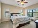 King-size bedroom with ample natural light and ceiling fan at 1748 Still River Dr, Venice, FL 34293