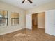 Spacious bonus room with tile flooring and two windows at 1748 Still River Dr, Venice, FL 34293