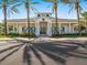 Community center with white columns and palm trees at 1748 Still River Dr, Venice, FL 34293