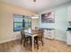 Bright dining area with table and chairs near kitchen at 1748 Still River Dr, Venice, FL 34293