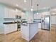 Modern kitchen with stainless steel appliances and island at 1748 Still River Dr, Venice, FL 34293