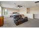 Large main bedroom with sitting area and carpet flooring at 1748 Still River Dr, Venice, FL 34293