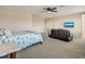 Main bedroom with sitting area and a king-size bed at 1748 Still River Dr, Venice, FL 34293