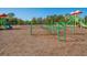 playground with various play structures and soft ground at 1748 Still River Dr, Venice, FL 34293