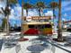 Outdoor food stand with tables and string lights at 1748 Still River Dr, Venice, FL 34293