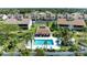 Aerial view of condo community with pool and lush landscaping at 1767 Lake Pl # 1767A, Venice, FL 34293