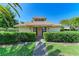 Community building entrance with manicured landscaping at 1767 Lake Pl # 1767A, Venice, FL 34293