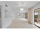 Dining area with tile floor and access to a screened porch at 1767 Lake Pl # 1767A, Venice, FL 34293