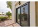 Private patio with sliding glass doors leading to the interior at 1767 Lake Pl # 1767A, Venice, FL 34293